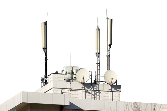 Telecommunication antennas transmitting cellular network signals on building rooftop