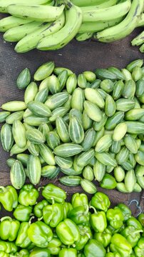 Fresh vegetables and fruits at local farmer's market stall 4k vertical video footage