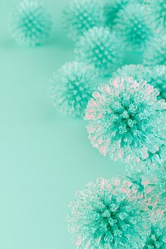Tropical green spheres float on soft mint background