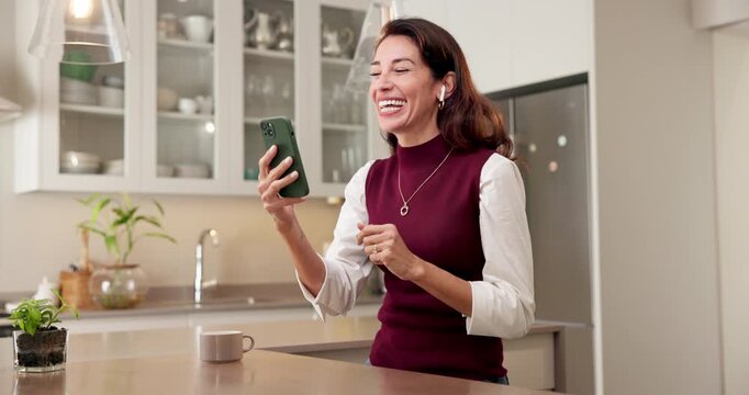 Happy, woman and video call with phone in kitchen for conversation, discussion or online meeting. Female person, user or talking with smile, earphones or technology for friendly chat or app in home