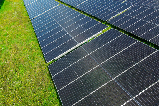 Large solar panel installation producing clean renewable energy in field