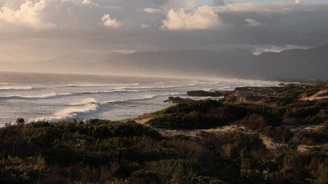 glorious Walker Bay Nature Reserve and massive wave sets, in late afternoon light , South Africa