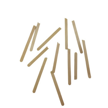 A collection of wooden craft sticks scattered randomly on a plain transparent background