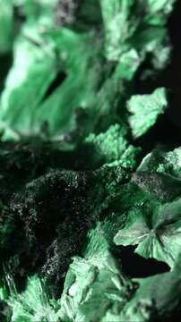 Malachite (green copper carbonate hydroxide) Fibrous chatoyant form giving cat's eye effect. Vertical