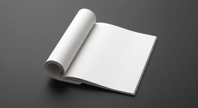Blank open magazine mockup on dark surface with rolled left page and empty right page for design presentation.