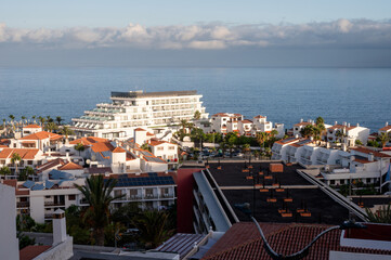 Curved hotel and holiday apartments above a calm ocean © Oksana