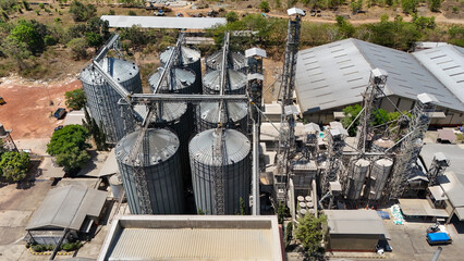 Industrial grain storage facility with metal silos and processing machinery in South Kalimantan © Salsabila Ariadina