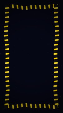 Yellow sticker notes forming a rectangular frame border on black background stop motion animation