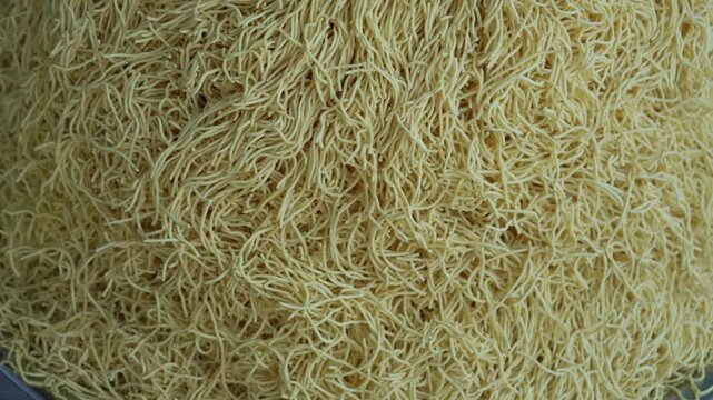 Crispy Indian sev and bhujia snack displayed in stack at local market