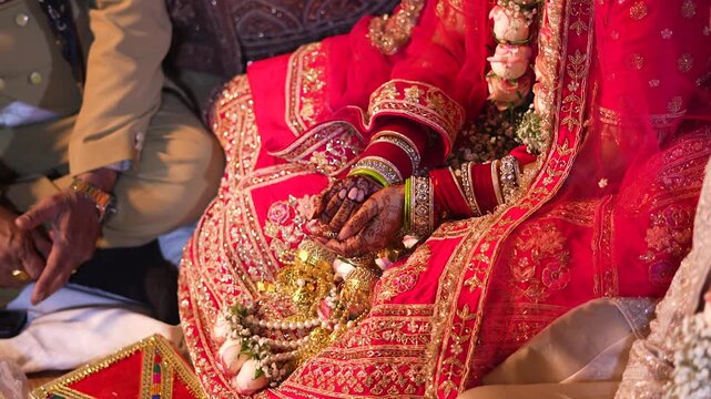 Indian bride wearing traditional red lehenga and bangles at a Lucknow wedding