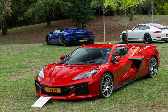 Mondorf-les-Bains, Luxembourg - September 13th 2026 : View on a red Chevrolet Corvette C8 Z06 parked on a lawn.