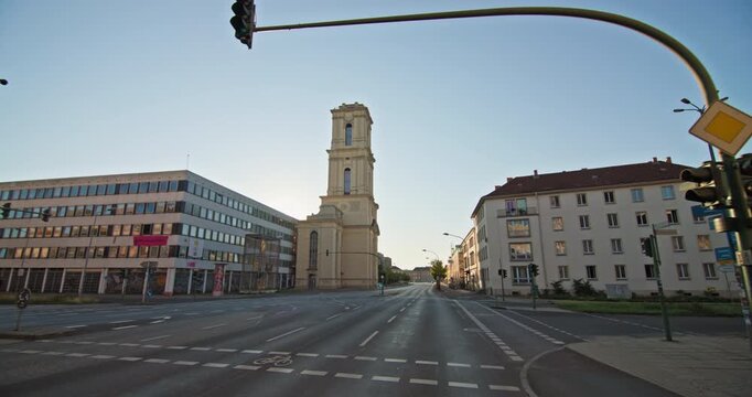 Potsdam, Germany: the reconstructed Garrison Church tower along Breite Strasse, with urban buildings and traffic lanes.