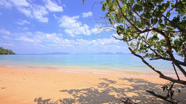 Paradise beach with sand and turquoise water on a tropical island in Phang Nga Bay, Thailand