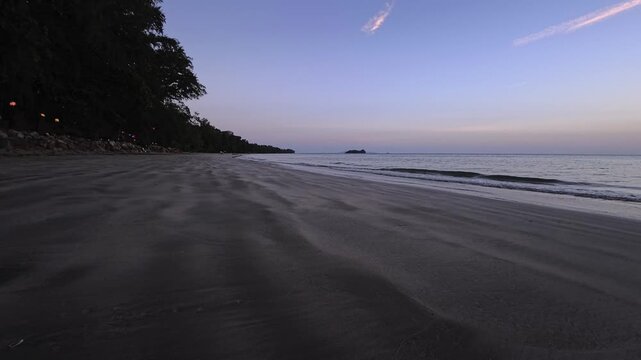 Sunset over a sandy beach on a tropical island in Thailand, Koh Jum