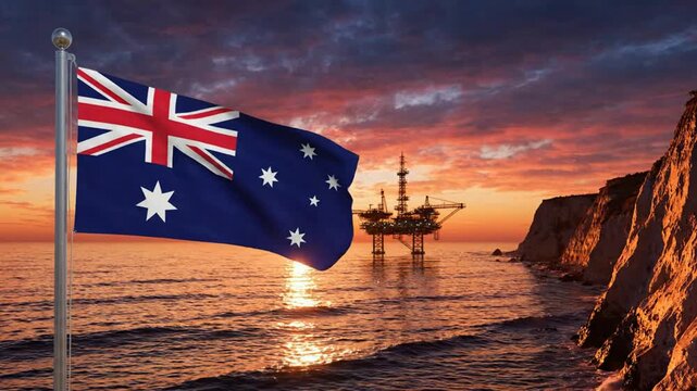 Australian flag waving at sunset with offshore oil rig platform in background, energy industry concept