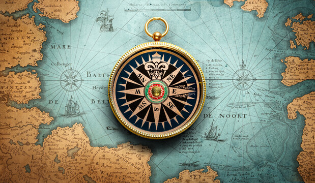Antique maritime compass placed on an old vintage map. Historical navigation instrument with visible aging, patina, and worn textures, symbolizing exploration, travel history, discovery.