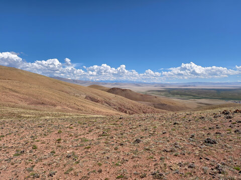Photo of Altai natural landscape under blue sky. Altai desert and semi-desert environment.