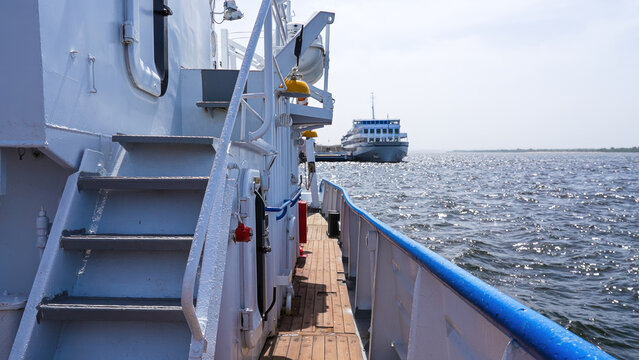 Ship deck with view of another vessel.
