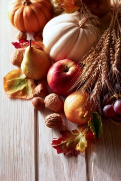 Autumn harvest still life with pumpkins and fresh fruit, vertical