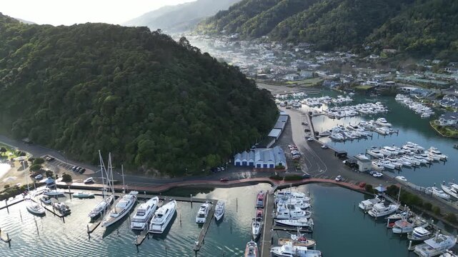 Picton port town aerial view reveals New Zealand urban scenery along Queen Charlotte Sound with beautiful Marlborough landscapes and coastal mountains for travel and tourism