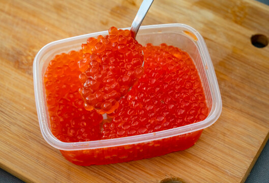 Salmon roe in a container ready for use in cooking or serving
