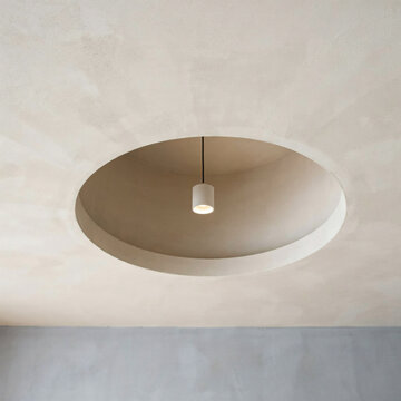 Minimalist circular ceiling architectural recess featuring a single modern pendant light fixture in a neutral toned interior space