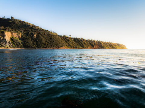 Bluff Cove Palos Verdes Estates coastline with calm ocean waters at sunset