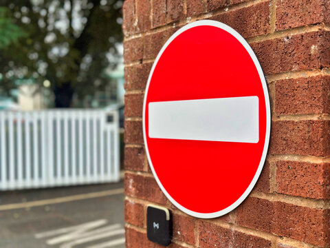 No Entry Road Sign Mounted on a Brick Wall Gate Entrance