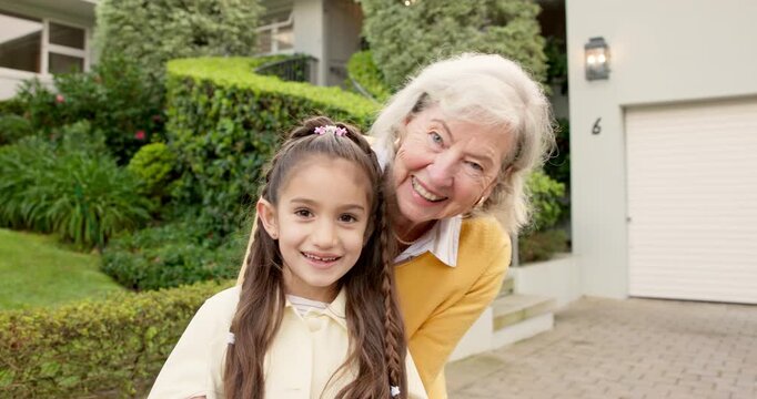 Face, grandmother and child outdoor with smile, love and parental support for quality time. Portrait, old woman and playing at house with grandchild, babysitting weekend and childcare for family fun