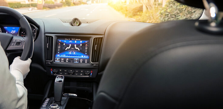 Luxury SUV Interior Driver View at Sunset Urban Road