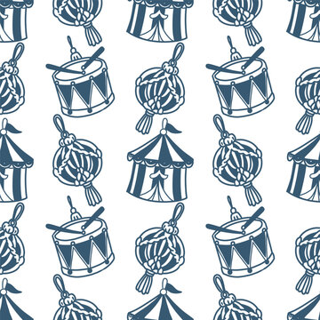 Seamless hand drawn Christmas pattern with festive ornaments, toy drums and hanging decorations in blue on a white background. Winter holiday design for wrapping paper, textiles and stationery.