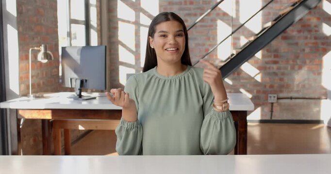 Close-up of people talking to the camera, woman explaining, gesturing in office space