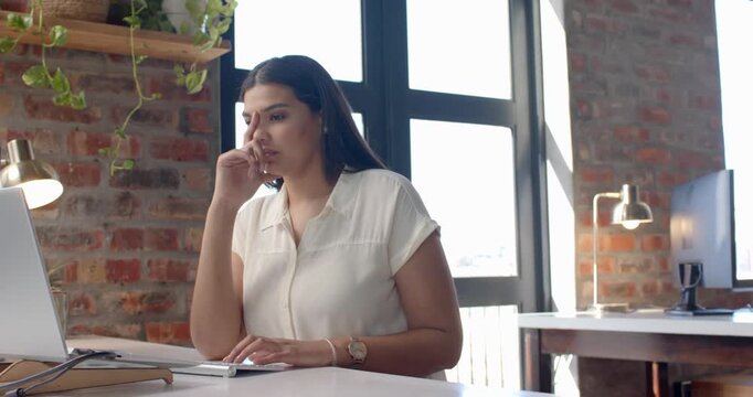 Lifestyle videos (indoor) of people doing activities at office, typing on laptop, woman working in m