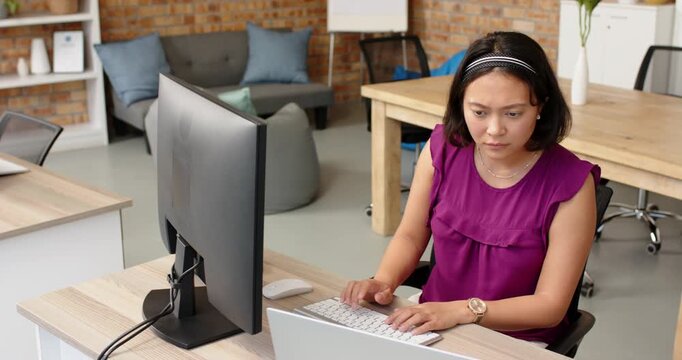 Lifestyle videos indoor of people doing activities at office, working in office, woman using desktop