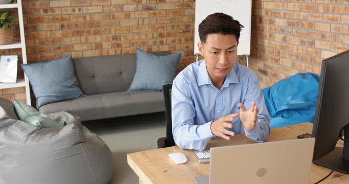 Lifestyle videos indoor of people doing activities at office, having video call, man in blue shirt u