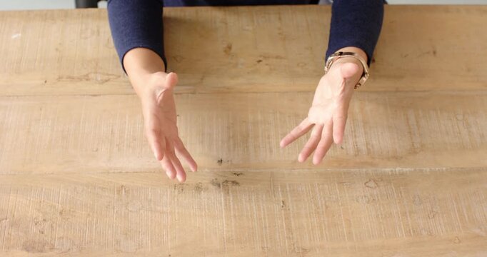 Close up of people talking to the camera, gesturing with hands, person in business attire explaining