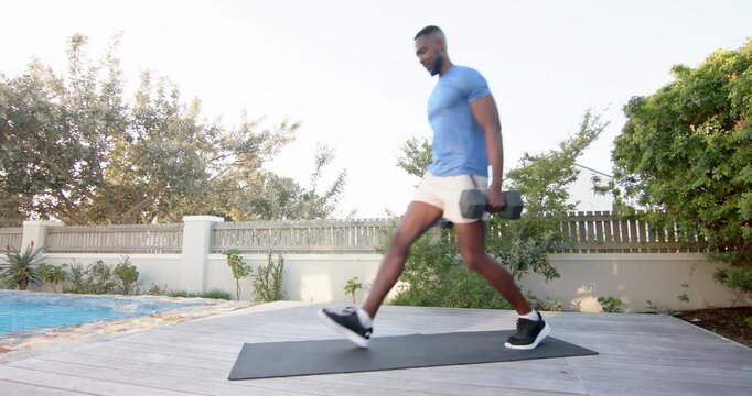 Lifestyle videos outdoor of people doing activities, exercising outdoors, man doing lunges on yoga m