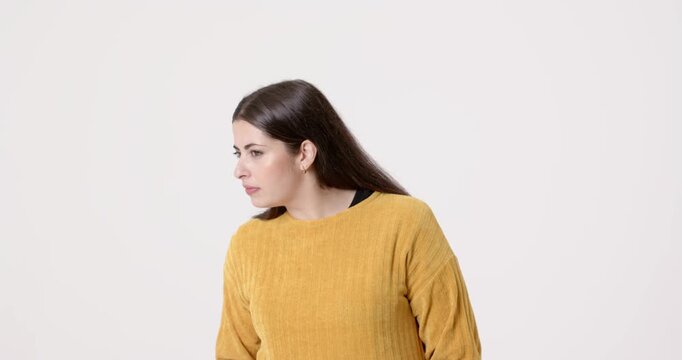 High-speed photography for dynamic scenes, woman in yellow sweater looking up with thoughtful expres