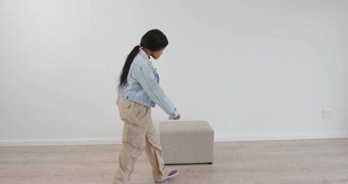 High-speed photography for dynamic scenes, sitting on stool, woman looking down and holding her knee
