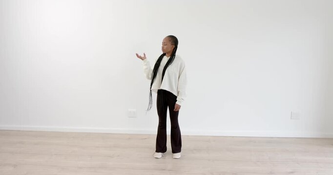High speed photography for dynamic scenes, Woman bending down and touching floor in minimalist room.