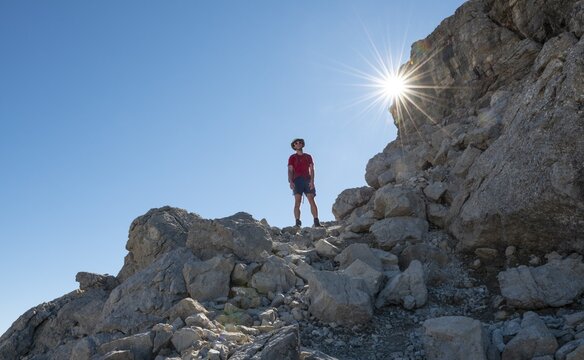 Hiker on their ascent to the Hochvogel, Sonnenstrahlen, Allg&auml;u, Allg&auml;u High Alps, Bavaria, Germany