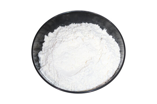 White flour in a black bowl isolated on transparent background for cooking and baking concepts