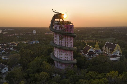 Aerial view, sun in the mouth of a dragon, Wat Samphan dragon temple, Bangkok, Thailand