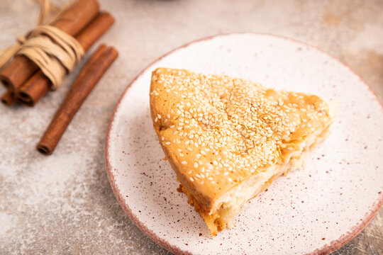 Apple Charlotte cake on brown concrete, side view, close up, selective focus