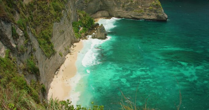 High angle view of turquoise tropical ocean and white sand beach on Bali Island during sunny day