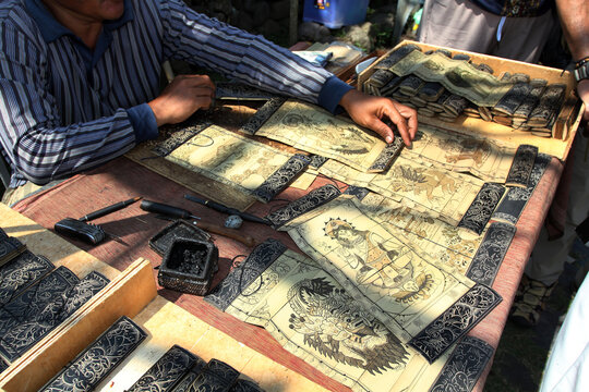 Balinese painting and writing on lontar leaves (Borassus flabellifer) known as "Prasi". Scratched with special knife called "Pangrupak" and smeared with burnt candlenut charcoal.