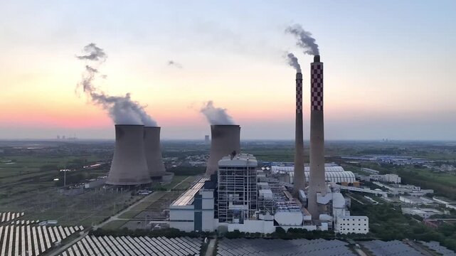Thermal power plant panorama at sunset