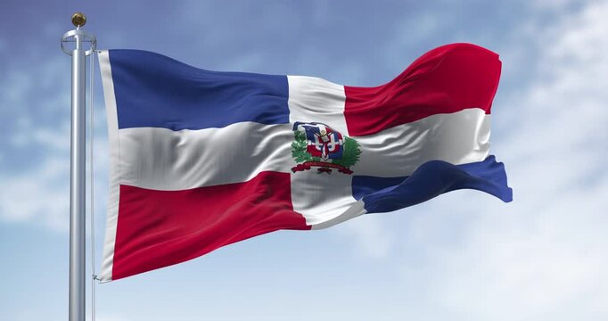 National flag of the Dominican Republic waving in the wind on a clear day