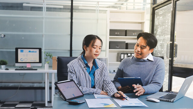 Business professional analyzing financial data on digital tablet dashboard with calculator and laptop, representing accounting software, ERP system integration, performance monitoring.