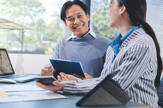 Business professional analyzing financial data on digital tablet dashboard with calculator and laptop, representing accounting software, ERP system integration, performance monitoring.